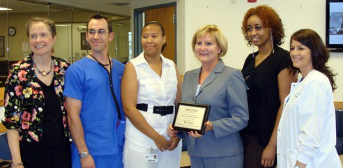 Herzing SGA Presents Plaque to Rep Fedor